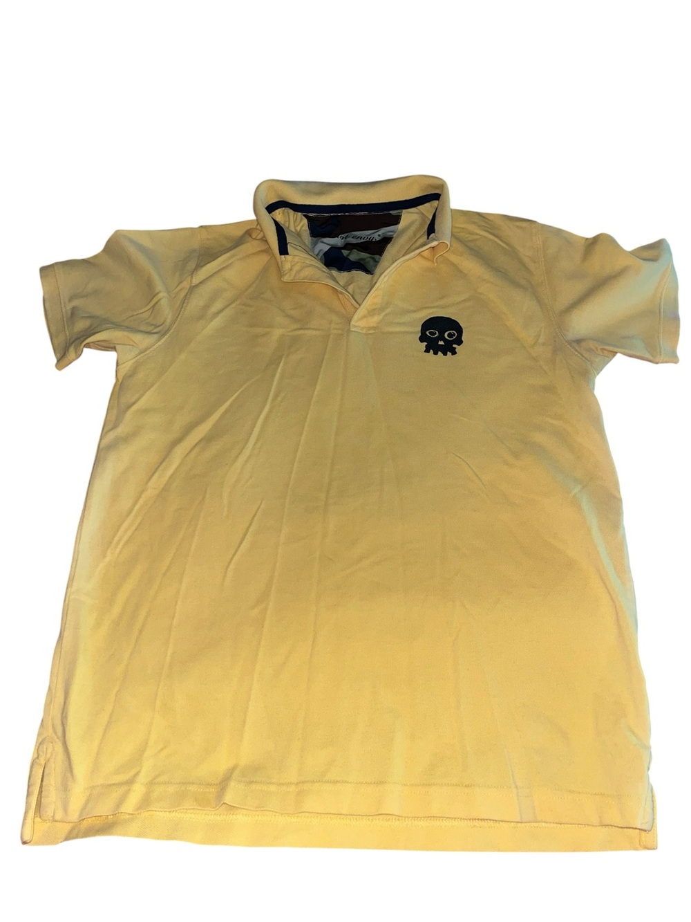Philipp Plein polo shirt features a distinct skull graphic on the chest.